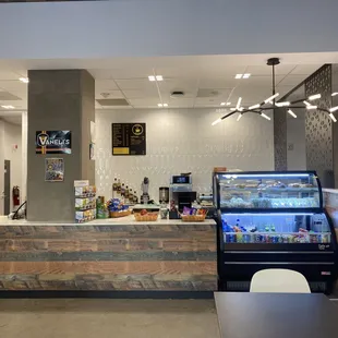 a coffee shop with a counter