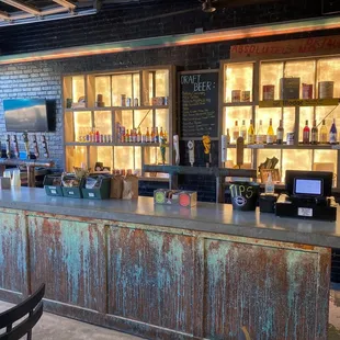 a bar with bottles of liquor on the counter