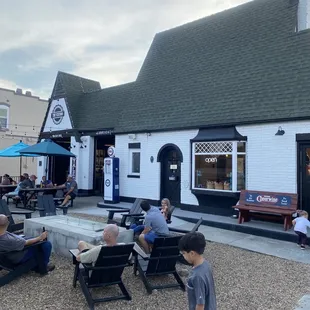 a group of people sitting outside