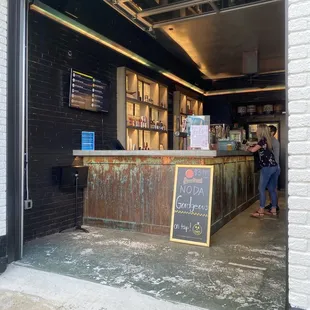 two people standing at the counter