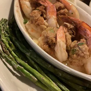 Shrimp entree, baked with seafood stuffing, and side of grilled asparagus
