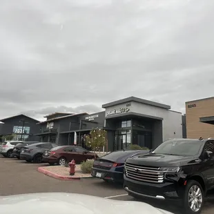 cars parked in front of a building