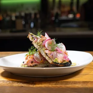 Smoked Salmon Toast House Smoked Salmon, Mashed Avocado, Radish, Pickled Red Onion, Dill, Lemon