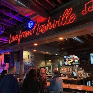 a group of people at a bar