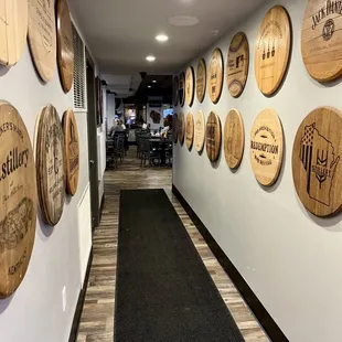a long hallway lined with wine barrels