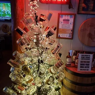 a christmas tree made out of liquor bottles