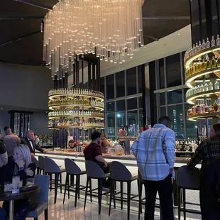 people sitting at the bar