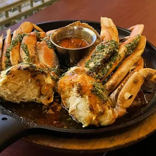 Savor our sizzling, herb-infused crab served with a side of rich dipping sauce--bursting with flavor and perfect for seafood lovers!