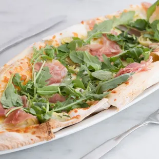 Prosciutto San Daniele pizza in an almond wood-fired oven