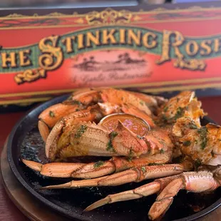 Brick Oven-Roasted Dungeness Killer Crab in our secret garlic sauce.
