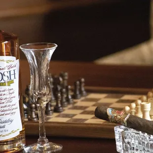 a bottle of scotch and a glass of wine