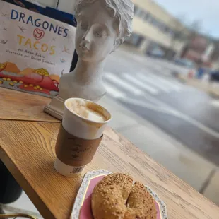 a cup of coffee and a bagel