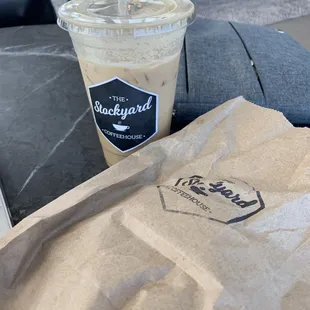 a cup of coffee and a paper bag