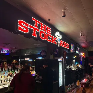 a bar with neon signs