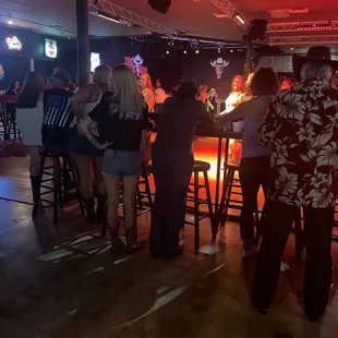 a group of people at a bar
