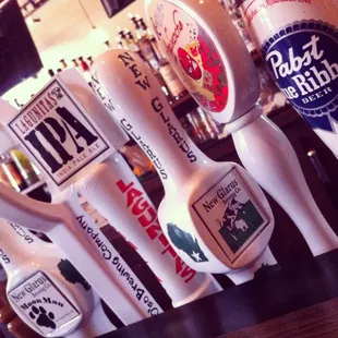 a row of beer taps on a bar