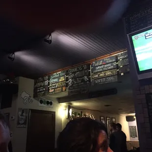 a man watching a baseball game on tv