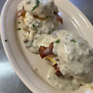 Bacon Egg and Cheese Biscuits topped with sausage gravy