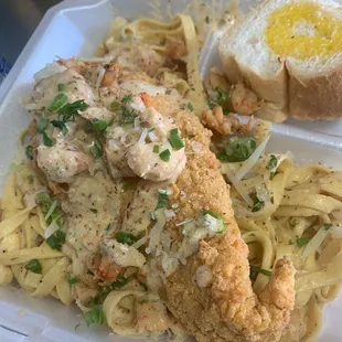 Bayou Catfish ( Fried Catfish fillet, butter garlic noodles, topped with Crawfish cream sauce)