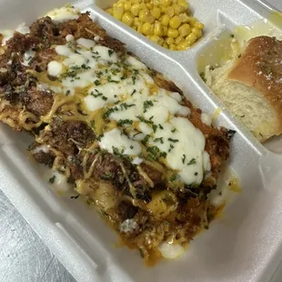 Beef Lasagna with seasoned Corn and buttered Roll