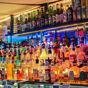 a bar filled with liquor bottles