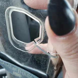 a hand holding a cell phone