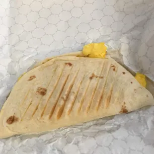 a burrito wrapped in plastic wrap