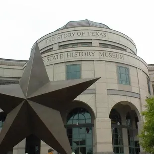 a large star in front of a building