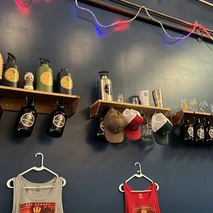 a wall of beer bottles and other items