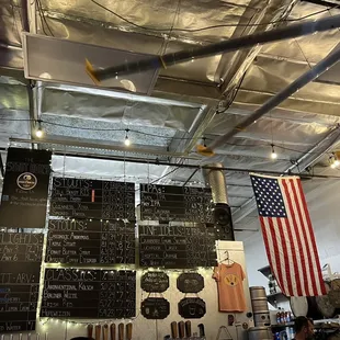 a bar with a large chalkboard