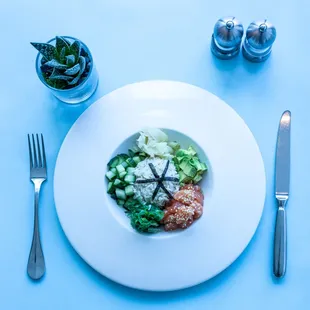 Salmon Poké Bowl with Avocado, Cucumber, Seaweed Salad, Pickled Ginger, Rice, Sesame Seed, Crispy Nori &amp; Soy Dressing