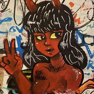 a painting of a woman with horns