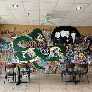 a wall covered in graffiti