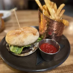 a burger and fries on a plate