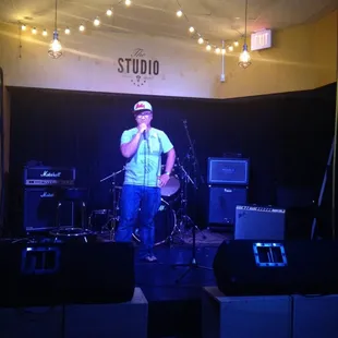 a man singing on stage