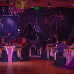 a group of people sitting at tables