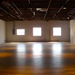 Big main room with wood flooring.