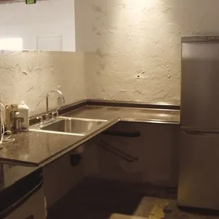 Kitchen with refrigerator