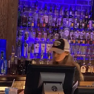 a bartender behind the bar