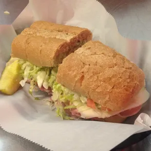 a sub sandwich with a pickle