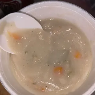 a bowl of soup with a spoon in it