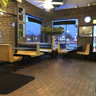 a restaurant with a brick floor