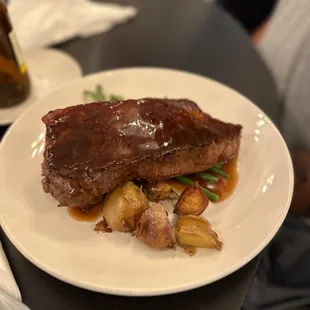 a plate of meat and potatoes
