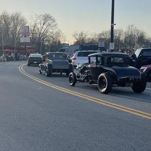 a group of cars driving down the road