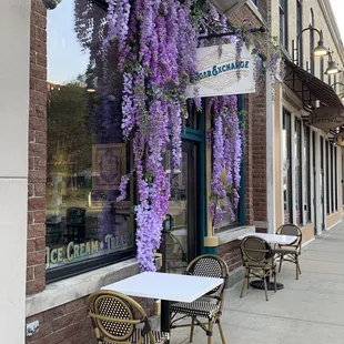 tables and chairs outside of the building