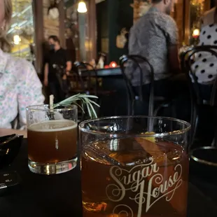 two glasses of beer on a table