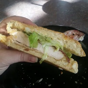 The Grilled chicken sandwich on ciabatta, buttery bread. Hold the tomato &amp; onion.