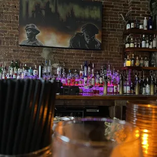 a bar filled with bottles of alcohol