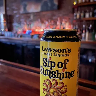 a can of beer on a bar