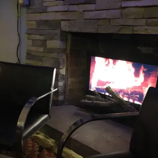 Seating area with a fireplace in the bar/lounge area.